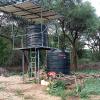 Villagers were getting water by digging holes in dry river bed.  Well installed with solar electricity.