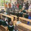 Students and parents celebrate new classrooms and prayer given for classsroom.